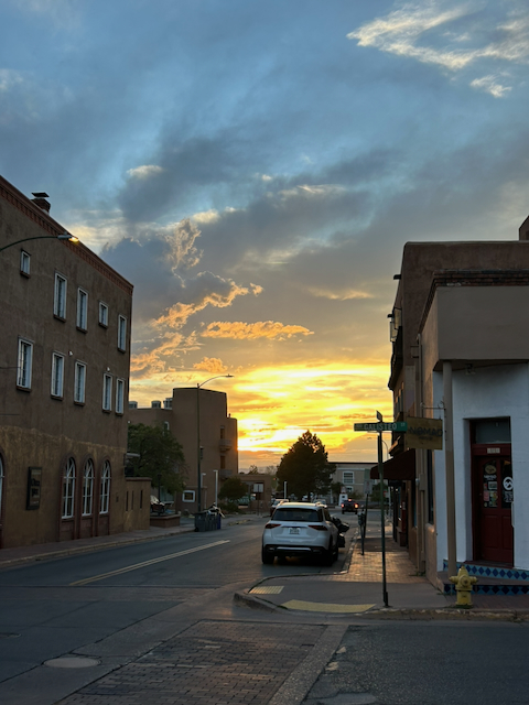 Sunset glowing at the end of a street in downtown Santa Fe